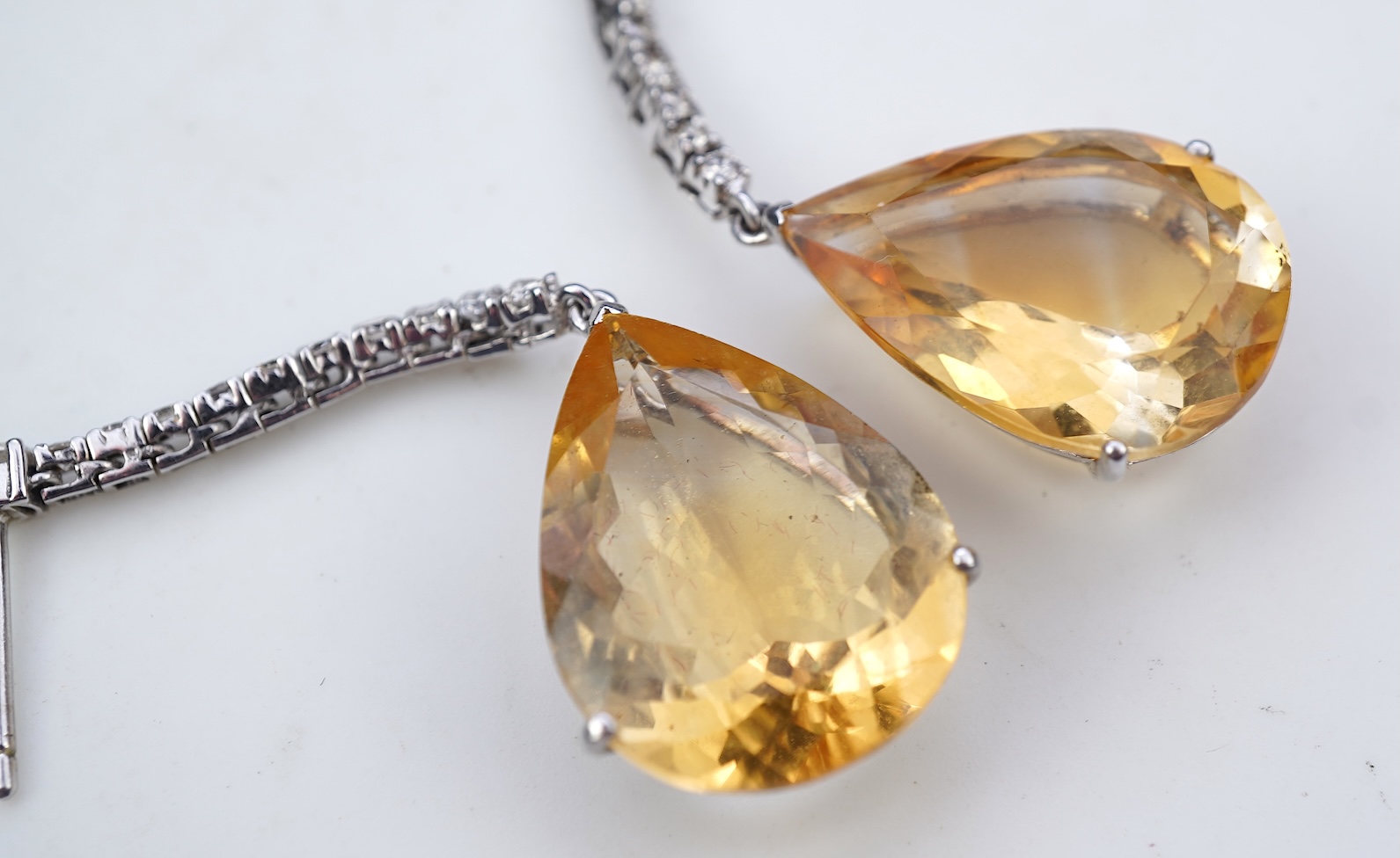 A pair of citrine and diamond earrings